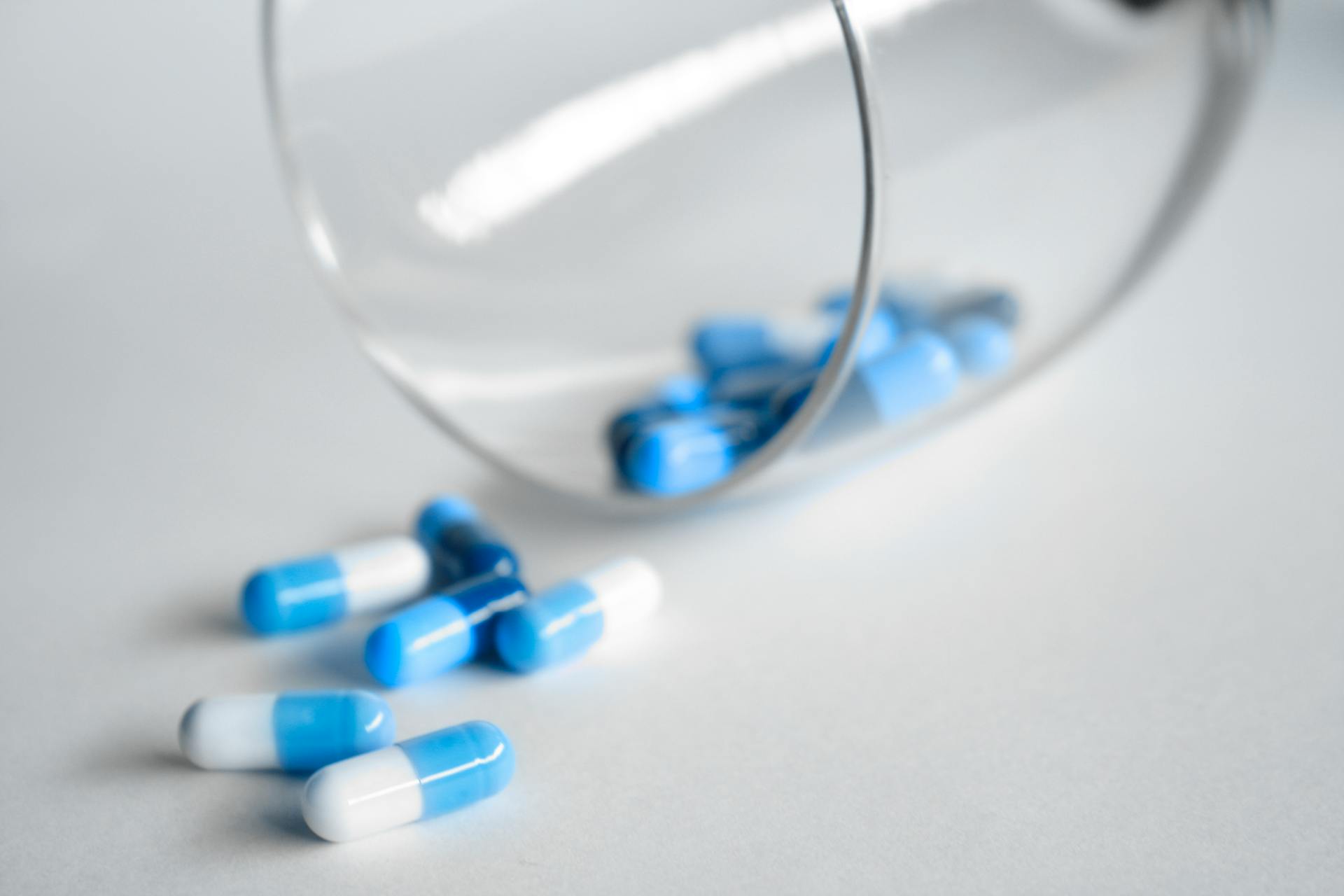 capsules coming out of a glass